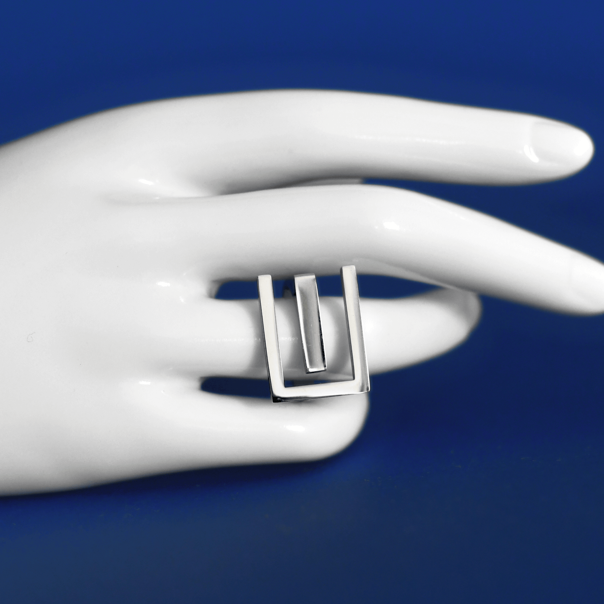 PROLIBE stainless steel statement ring in silver on finger - Alogan